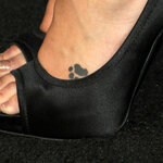 laura-vandervoort-pawprint-foot-tattoo.jpg