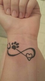 New tattoo_ Paw print, horse shoe, heart and infinity sign.jpeg
