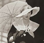 Young woman with umbrella and flowers.jpg