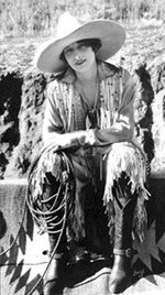 Vera McGinnis - 1918 - The first Cowgirl to wear pants in the rodeo arena, by the Blucher Cust...jpg